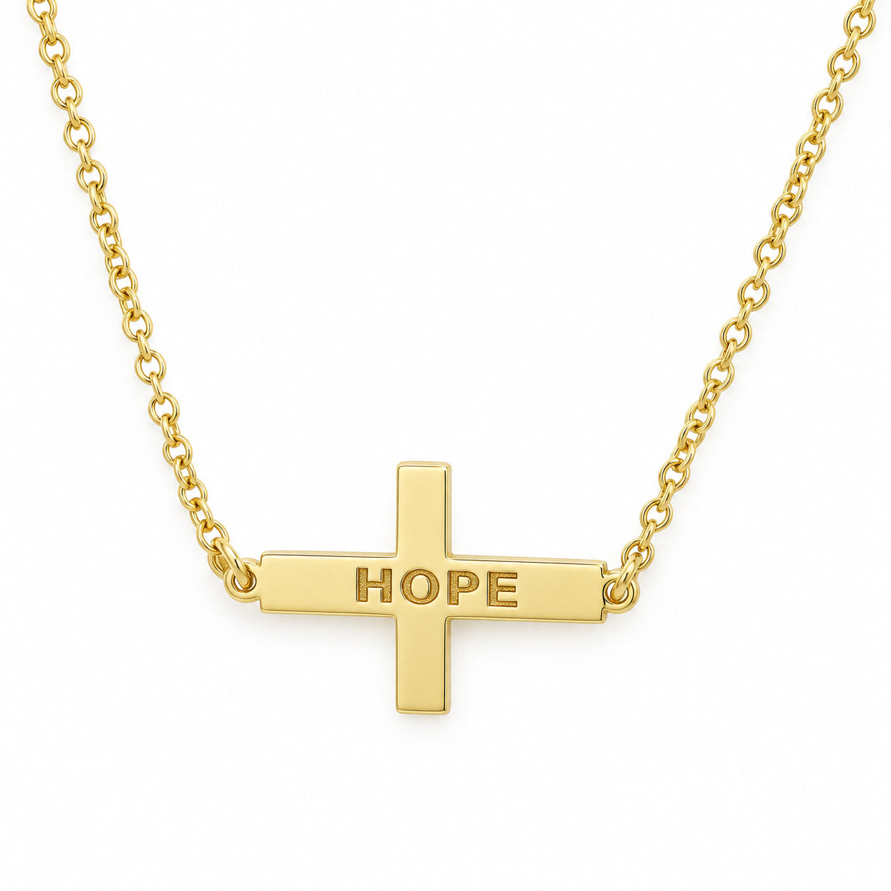 Yellow gold sideways cross necklace engraved HOPE with a split rolo chain on a white background.