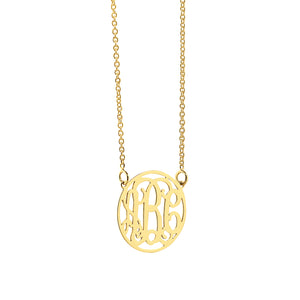 Front view of a small solid gold circle pendant necklace with a personalized three-initial monogram.