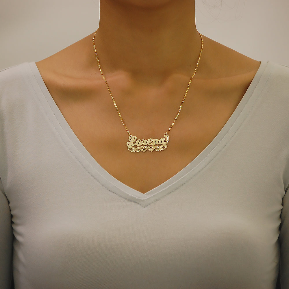 Model wearing a custom 10k solid yellow gold personalized script name necklace.