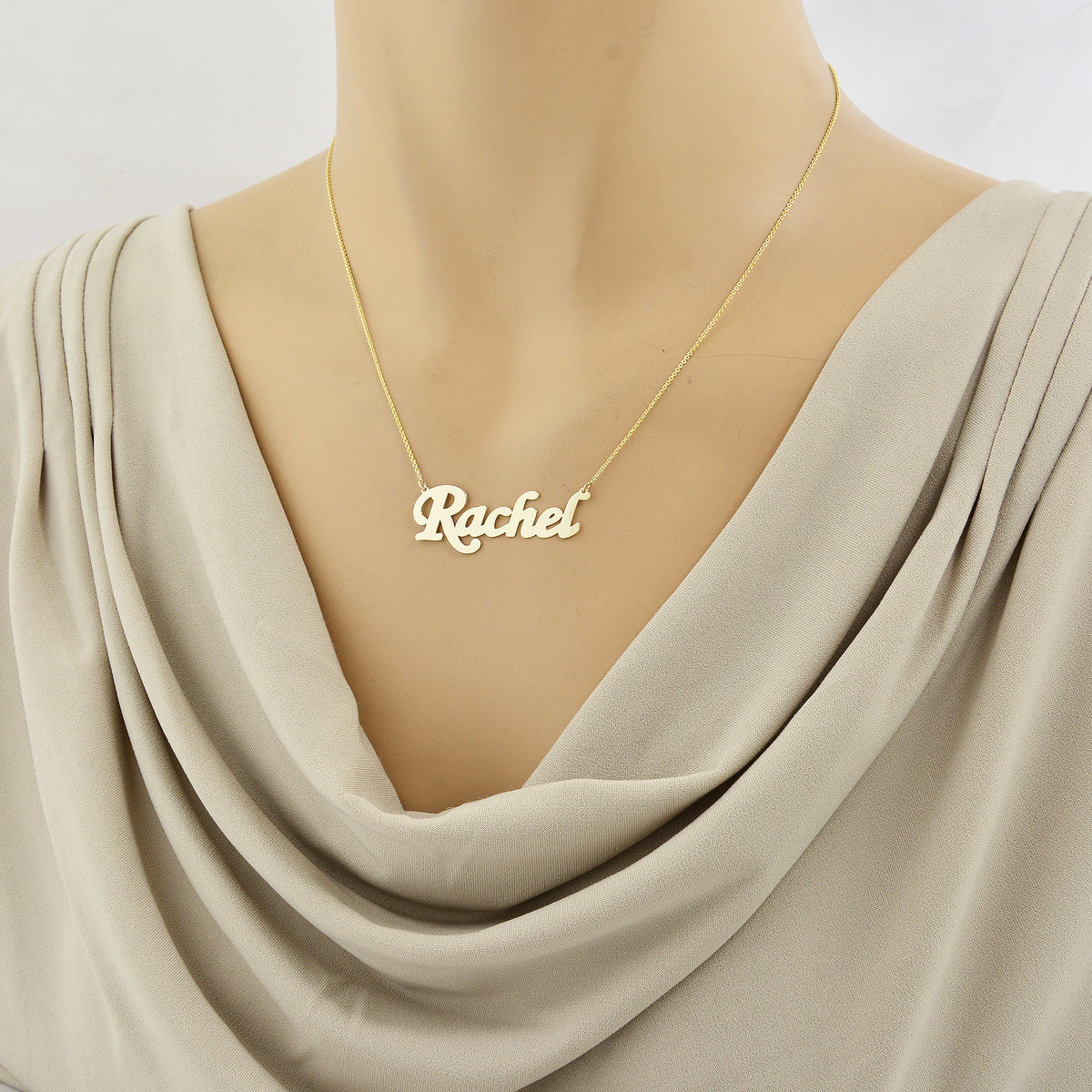 Woman wearing 10k solid gold Rachel script nameplate necklace