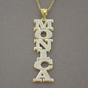 Close-up of two-tone 14K gold 3D double plate personalized name pendant