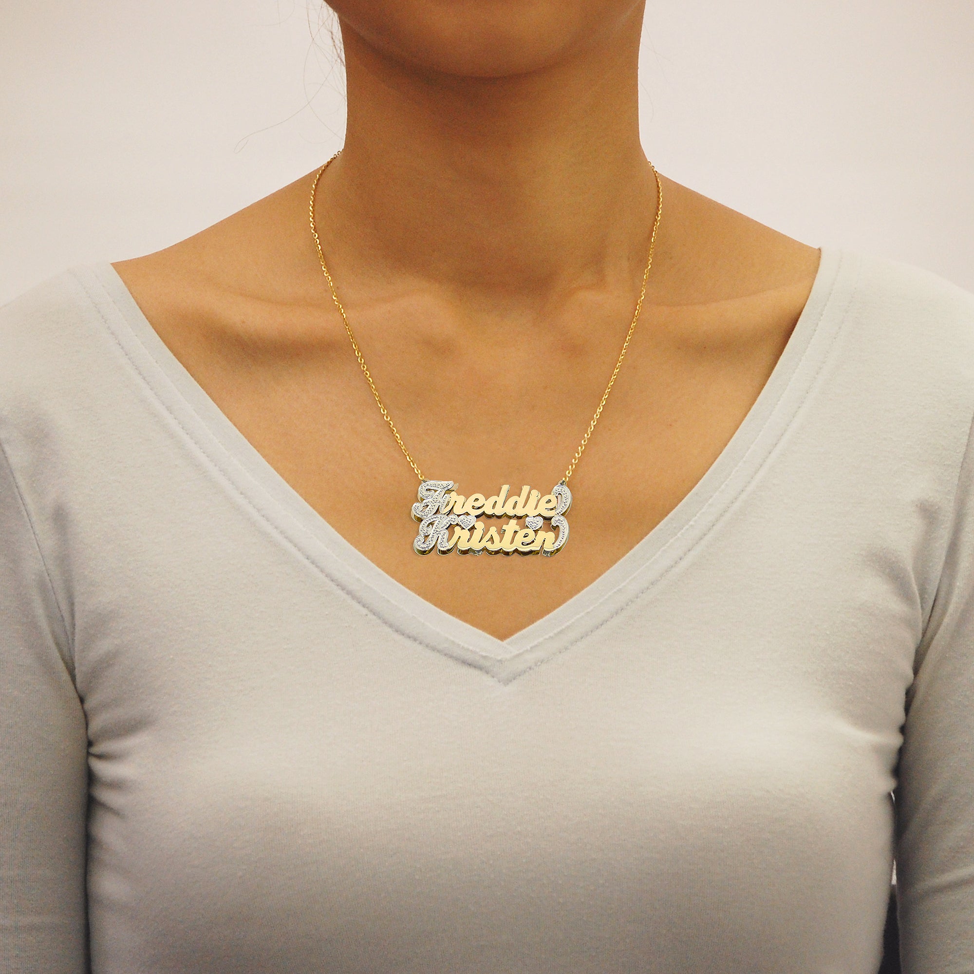 Side view of the 3D double-layered solid gold couple name pendant showing top and bottom plate thickness.