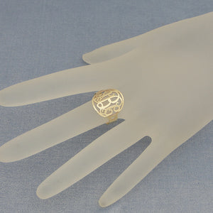 Handwearing personalized 3-letter circle monogram ring in real gold for sizing and fit demonstration.