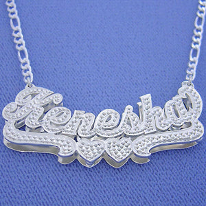 Custom 2-inch sterling silver 3D double-plated name necklace with diamond accents and Figaro chain.