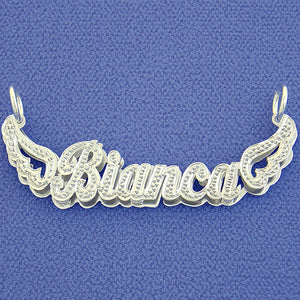 Personalization example featuring a 3D double plate sterling silver name pendant spelling "Bianca" with diamond-accented cursive lettering and detailed angel wings on each side.