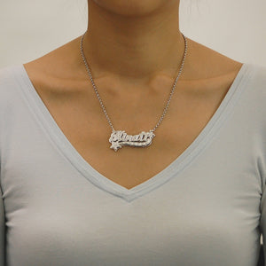 Model wearing the personalized sterling silver 3D double plate star name necklace on a rolo chain.