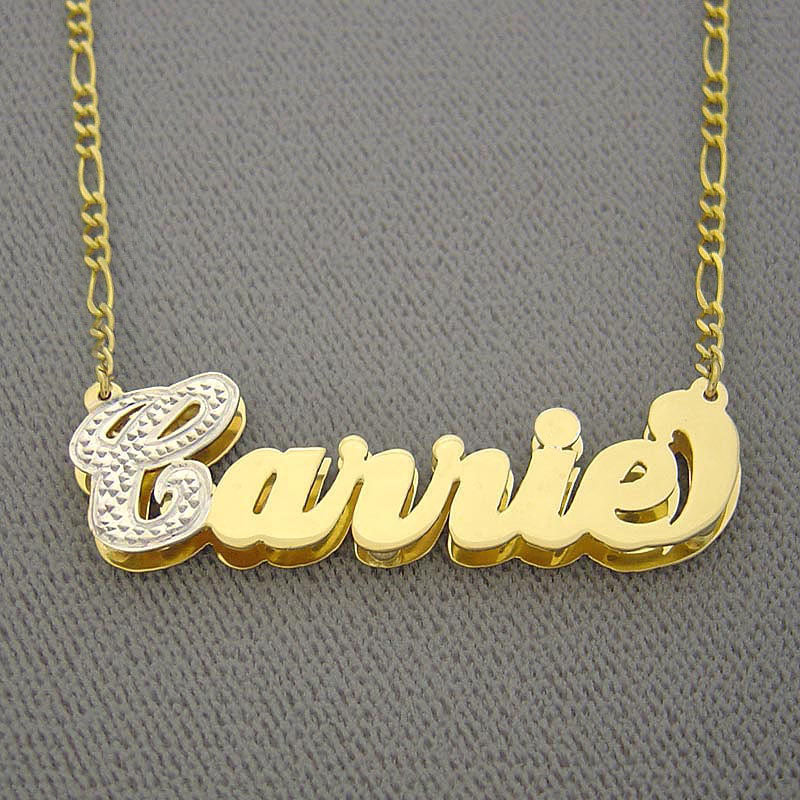 Close-up of custom two-tone gold double layer Carrie nameplate necklace inside a jewelry presentation box.