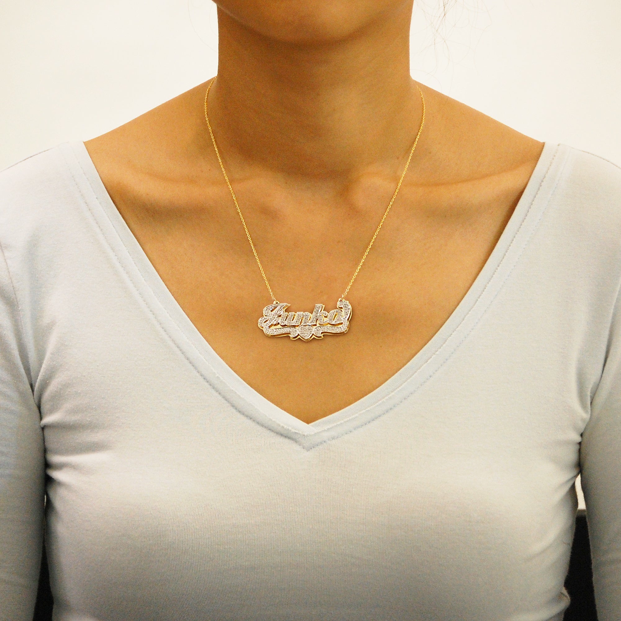 Model wearing customized solid gold 3D double plate name pendant necklace
