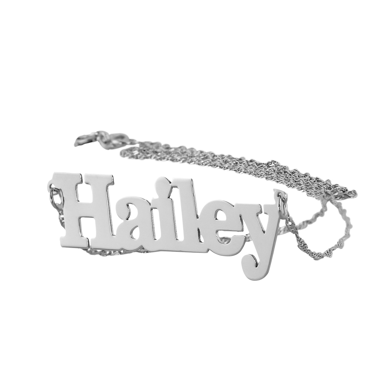 White gold or silver custom block font name necklace display.