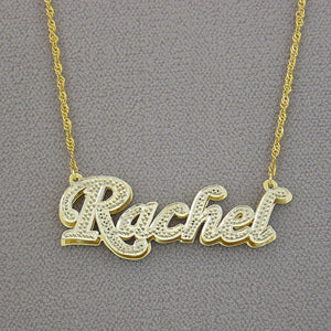 Back view showing the solid gold double plate backing construction of the custom 3D name pendant.