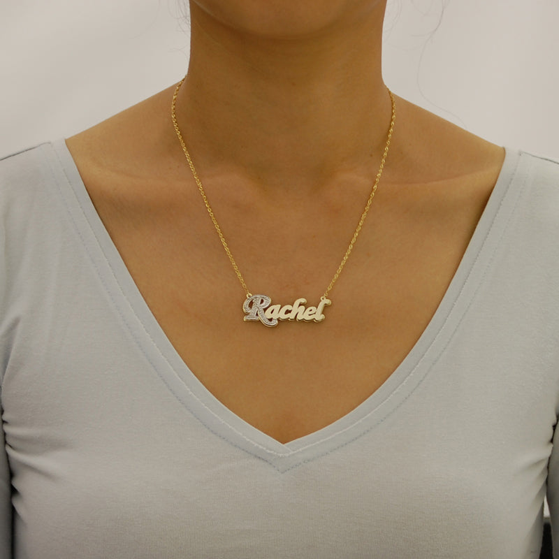 Model wearing a custom 10K two-tone solid gold double-plate script nameplate necklace.
