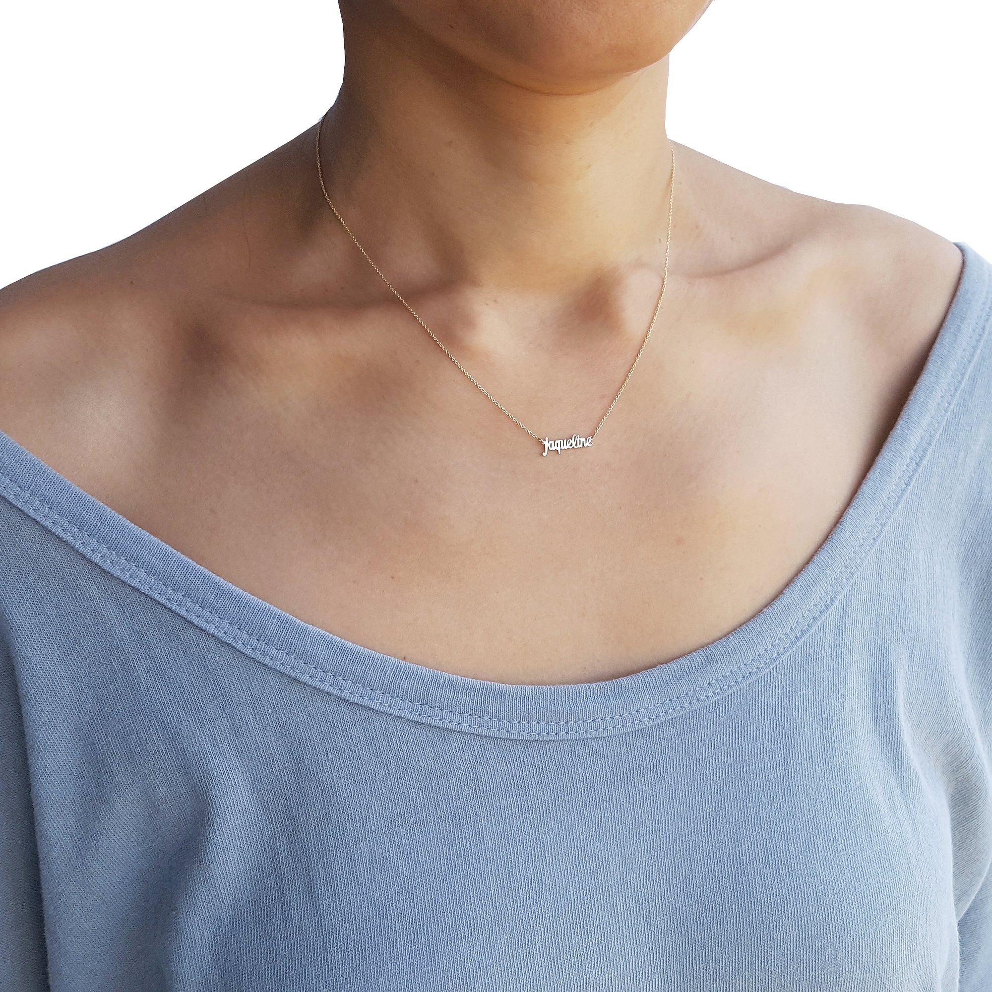 Model wearing an extra small solid gold personalized name necklace