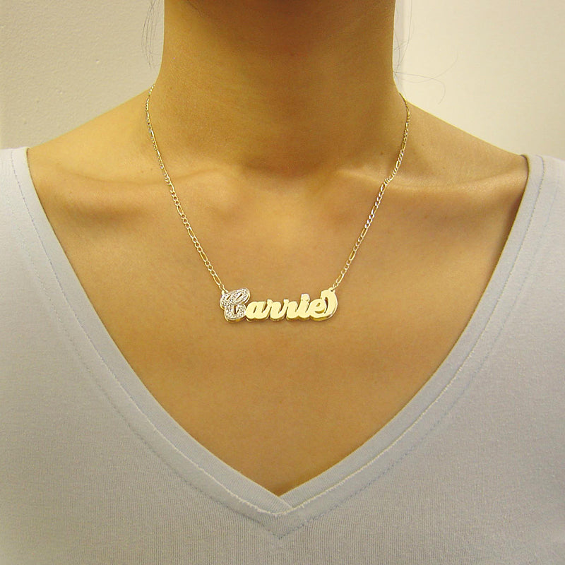 Model wearing a personalized 3D gold Carrie style double plate nameplate necklace attached to a gold chain.