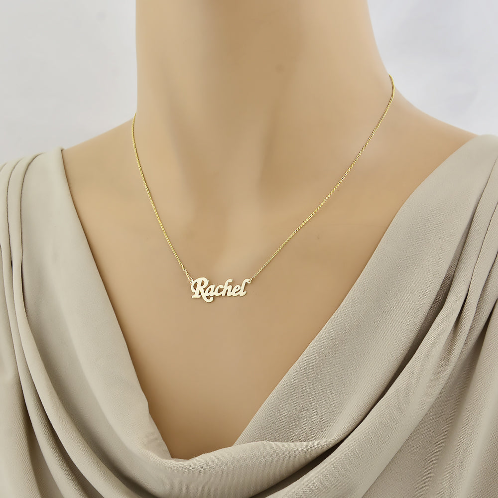 Custom gold name necklace draped elegantly on a display mannequin