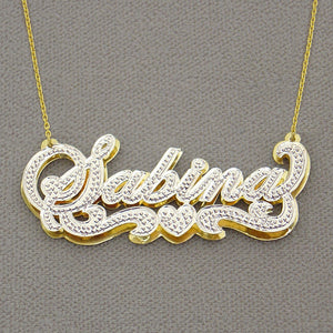 handcrafted 14K gold custom nameplate charm displaying solid backing construction