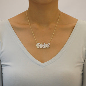 Model wearing personalized 10k solid gold diamond accent name necklace.