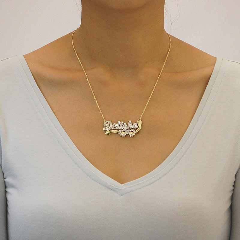 Model wearing a personalized two-tone 10K solid gold Cupid heart nameplate pendant on a gold chain.