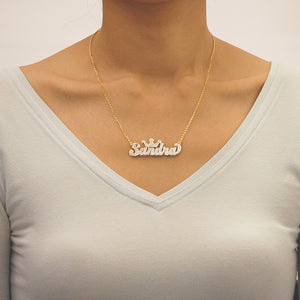 Model wearing custom solid gold 3D double plate personalized name crown pendant necklace