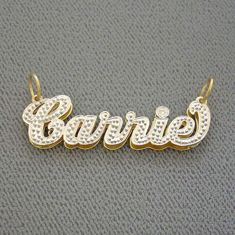 Close-up side view showing the 3D double-layer depth and diamond-cut texture of the custom gold name pendant.
