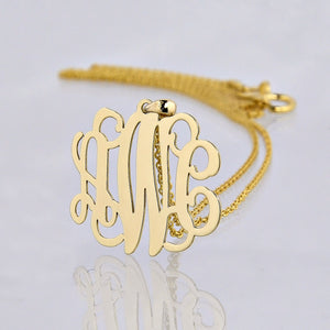 Small 14k yellow gold three-initial script monogram pendant necklace with polished reflective detail
