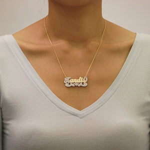 Model wearing the personalized 3D two-tone gold nameplate necklace with a gold rolo chain.